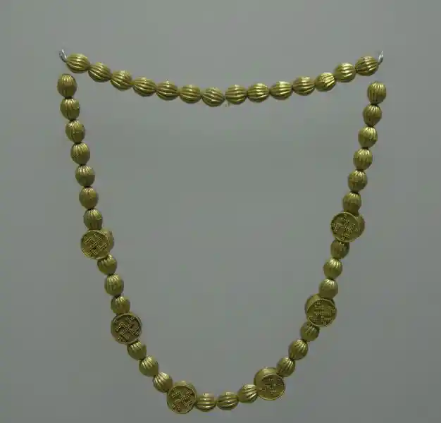 A prechristian gold necklace that looks like a rosary